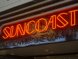 The neon sign of the Suncoast Motion Picture Company store in Omaha, NE