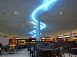 A picture of the wavy blue and white ceiling neon in the Valley West Mall.