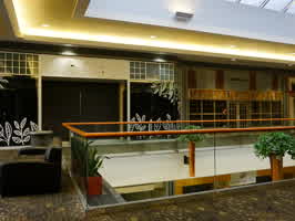A picture showing three empty storefronts in the Valley West Mall.