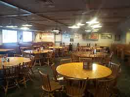 A room of empty dining tables