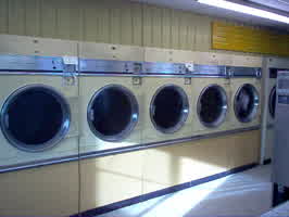 Dryers at a laundromat, half out of service