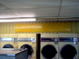 Rules posted above a laundromat dryer
