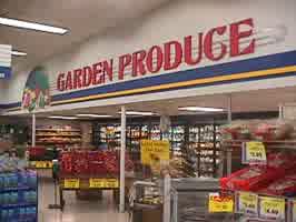 The produce section, with a large sign above reading 'Garden Produce'.