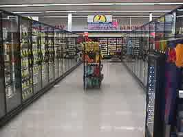 Aisle 7 of the Food Pride, with freezers lining the aisle.