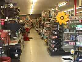 An image inside the hardware store, with various shelves containing various items.