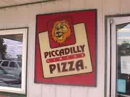 A sign with the Piccadilly Pizza logo.